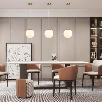 Modern Adjustable Single Light Glass Globe Pendant with Brushed Brass Finish