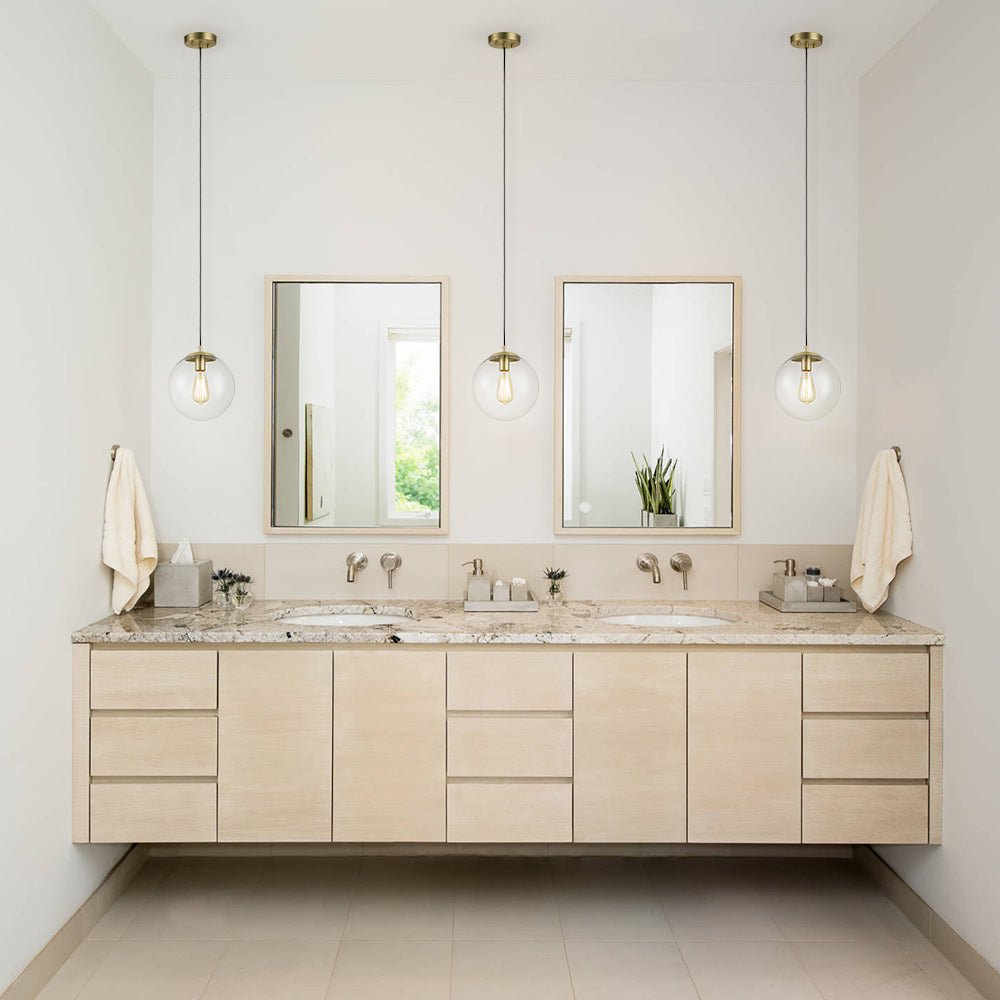 Modern Adjustable Single Light Glass Globe Pendant with Brushed Brass Finish